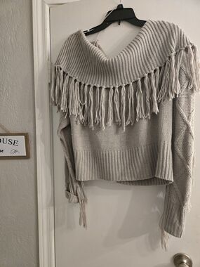 POL Cropped Off-the-Shoulder Fringe Sweater in Light Taupe